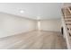 Spacious living room with wood floors, staircase and fireplace at 4212 W Pondview Dr, Littleton, CO 80123