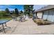 Outdoor patio overlooks the backyard pond with furniture for relaxing at 4212 W Pondview Dr, Littleton, CO 80123
