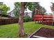 Backyard featuring grass, a red deck and wooden fence at 2777 S Sedalia St, Aurora, CO 80013