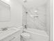 Modern bathroom features a tub, shower, and vanity with marble countertops at 2777 S Sedalia St, Aurora, CO 80013