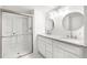 Bright bathroom featuring a double vanity and large glass shower at 2777 S Sedalia St, Aurora, CO 80013
