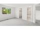 Bright bedroom with large window and doorway to the bathroom and closet at 2777 S Sedalia St, Aurora, CO 80013