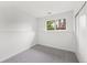 Finished bedroom with neutral carpet, white walls and bright window at 2777 S Sedalia St, Aurora, CO 80013