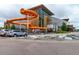Community pool area featuring a large water slide and a modern recreation center, offering residents a fun aquatic experience at 2777 S Sedalia St, Aurora, CO 80013
