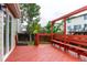 A view of the expansive red deck which has built-in bench seating and lots of room for outdoor entertaining at 2777 S Sedalia St, Aurora, CO 80013