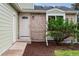 Front door entrance with brick detail and manicured landscaping at 2777 S Sedalia St, Aurora, CO 80013
