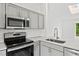 Bright kitchen with stainless steel appliances and white subway tile backsplash at 2777 S Sedalia St, Aurora, CO 80013