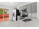 Updated kitchen features a stainless steel sink, faucet, and bright countertops at 2777 S Sedalia St, Aurora, CO 80013