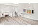 Spacious living area features stairs, hardwood floors, and access to kitchen at 2777 S Sedalia St, Aurora, CO 80013