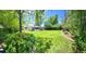 Expansive backyard with lush lawn and mature trees offering lots of space for outdoor activities at 4425 E Harvard Ave, Denver, CO 80222