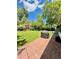 Well-manicured backyard with a brick patio and grill, ideal for summer barbecues and outdoor living at 4425 E Harvard Ave, Denver, CO 80222