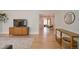 Open-concept living space featuring hardwood floors, stylish furniture and a seamless flow to the dining area at 4425 E Harvard Ave, Denver, CO 80222