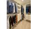 Well-organized walk-in closet with custom shelving and ample storage for clothes and accessories at 4425 E Harvard Ave, Denver, CO 80222