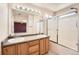 Bright bathroom with dual sinks, shower/tub combination and lots of natural light at 20229 E Red Fox Ln, Centennial, CO 80015