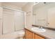 Bathroom featuring updated fixtures, a large mirror, sleek countertop, and shower with sliding glass doors at 20229 E Red Fox Ln, Centennial, CO 80015