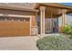 Charming two-story home featuring a well-maintained front yard and a two-car garage at 20229 E Red Fox Ln, Centennial, CO 80015