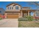 Charming two-story home featuring a well-maintained front yard and a two-car garage at 20229 E Red Fox Ln, Centennial, CO 80015