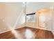 Bright living room featuring hardwood floors, large windows and tall ceiling at 20229 E Red Fox Ln, Centennial, CO 80015
