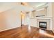 Bright living room featuring hardwood floors and a fireplace at 20229 E Red Fox Ln, Centennial, CO 80015