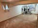 Spacious basement featuring exercise equipment and carpeting at 14963 E Adriatic Pl, Aurora, CO 80014
