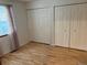 Bedroom with closet and laminate floors at 14963 E Adriatic Pl, Aurora, CO 80014