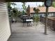 A spacious deck features outdoor seating and a grill, perfect for entertaining at 14963 E Adriatic Pl, Aurora, CO 80014