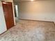 Living room with neutral carpet and plenty of natural light at 14963 E Adriatic Pl, Aurora, CO 80014