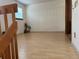 Spacious loft area featuring hardwood floors and natural lighting, suitable for flexible living at 14963 E Adriatic Pl, Aurora, CO 80014