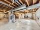 Unfinished basement with exposed ceiling and concrete flooring at 6768 Vivian St, Arvada, CO 80004