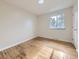Bedroom with light wood flooring, neutral walls, and bright light from the window at 6768 Vivian St, Arvada, CO 80004