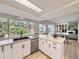 Bright kitchen featuring sleek countertops, stainless steel appliances, and a view to the outdoor space at 6768 Vivian St, Arvada, CO 80004
