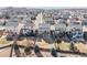 An aerial view of a well-planned suburban community, showcasing homes with fenced backyards, decks, and convenient access at 7686 Grady Cir, Castle Rock, CO 80108