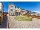 Backyard showcasing a well-maintained lawn and stone landscaping at 7686 Grady Cir, Castle Rock, CO 80108