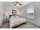 Bright bedroom with a ceiling fan, bedside tables, and natural light from the window at 7686 Grady Cir, Castle Rock, CO 80108