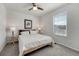 Cozy bedroom with a comfortable bed, side tables, and a large window with a scenic view at 7686 Grady Cir, Castle Rock, CO 80108