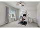 Well-lit bedroom with a ceiling fan, desk, computer, and a comfortable chair, perfect for a home office setup at 7686 Grady Cir, Castle Rock, CO 80108