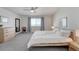 Serene bedroom featuring a bed, dresser, and large window, creating a peaceful and inviting atmosphere at 7686 Grady Cir, Castle Rock, CO 80108