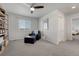 Cozy bedroom featuring carpet, a ceiling fan, and ample natural light at 7686 Grady Cir, Castle Rock, CO 80108
