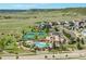 Aerial view of Cobblestone Ranch Clubhouse with pool and sports facilities at 7686 Grady Cir, Castle Rock, CO 80108