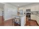 Bright kitchen featuring stainless steel appliances, a center island, and bar stool seating at 7686 Grady Cir, Castle Rock, CO 80108