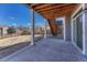 Covered patio with a concrete floor, offering a shaded outdoor space overlooking the backyard and neighborhood at 7686 Grady Cir, Castle Rock, CO 80108