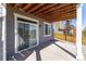 Covered patio area with a sliding door entry into the home's interior at 7686 Grady Cir, Castle Rock, CO 80108