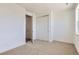 Neutral bedroom with carpet flooring, closet and adjoining bathroom entrance at 20578 E 63Rd Ave, Aurora, CO 80019
