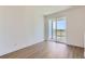 Bright bedroom featuring a sliding glass door to a balcony and light, wood-look flooring at 20578 E 63Rd Ave, Aurora, CO 80019