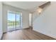 Bright living room featuring a sliding glass door to a balcony and stairs to another level at 20578 E 63Rd Ave, Aurora, CO 80019