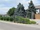 Community Entrance featuring a landscaped entrance and stone pillar at 8470 S Little Rock Way # 101, Highlands Ranch, CO 80126