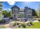 Inviting backyard with a stone patio, outdoor seating, and a modern fire pit at 7067 Gray Fox Ct, Highlands Ranch, CO 80130