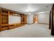 Finished basement featuring built-in shelving, recessed lighting, and carpet floors at 7067 Gray Fox Ct, Highlands Ranch, CO 80130