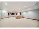 Finished basement with neutral carpet, recessed lighting, and a comfortable seating area at 7067 Gray Fox Ct, Highlands Ranch, CO 80130