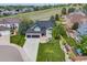 Aerial view of a gray two-story home with landscaped yard and three-car garage at 7067 Gray Fox Ct, Highlands Ranch, CO 80130